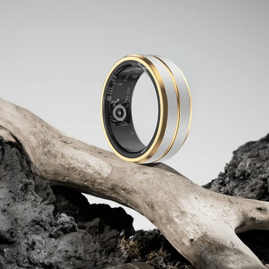 Smart gold and silver fitness ring on driftwood, Absolute Level Up tech accessory